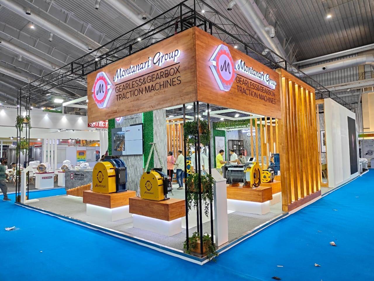 Montanari Group exhibition stand with warm timber finishes in Bangalore, designed and built by Vasant Creative