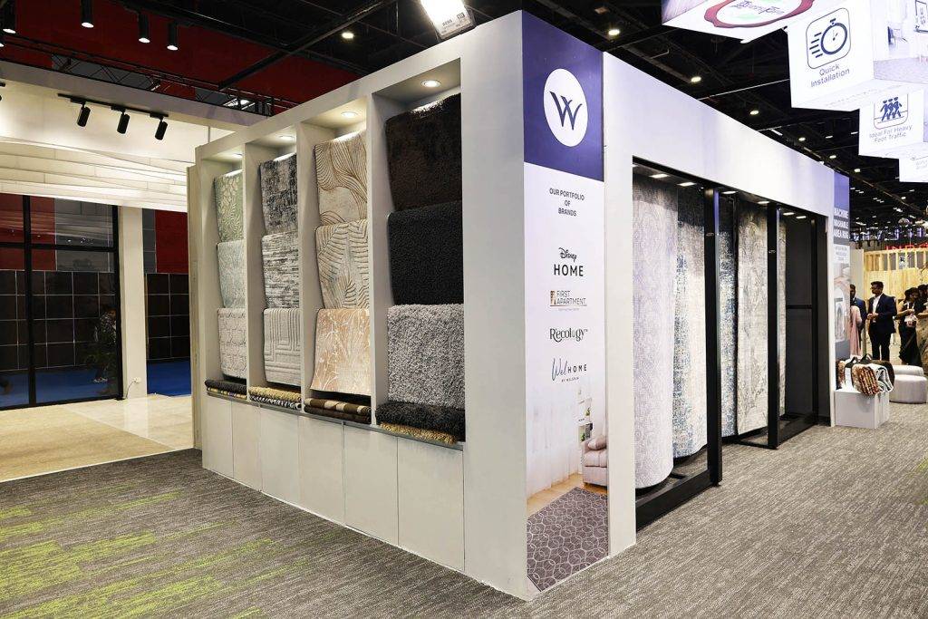 Welspun exhibition stand with rugs and flooring display by Vasant Creative
